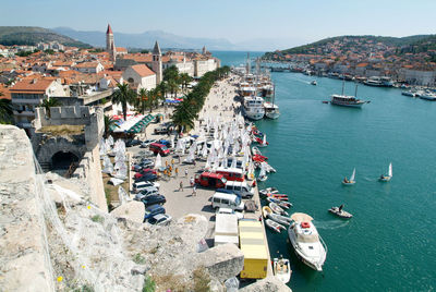 High angle view of townscape by sea