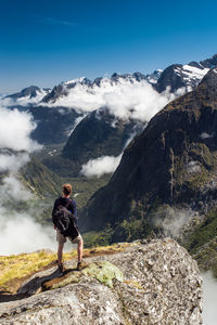 Rear view of man of man hiking in fiordland national park