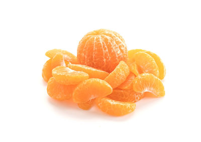 Close-up of orange slice over white background