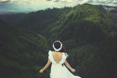 Woman standing on mountain