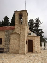 Low angle view of bell tower against sky