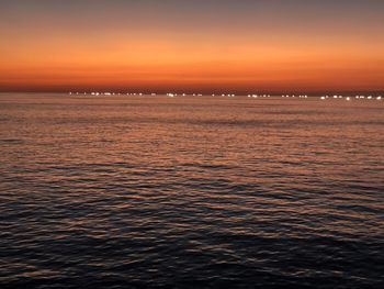 Scenic view of sea against sky at sunset