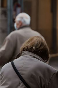 Rear view of man with woman hair