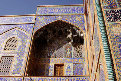 Low angle view of ornate gate of building