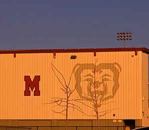 Low angle view of sign against clear sky