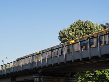 Low angle view of train against clear sky