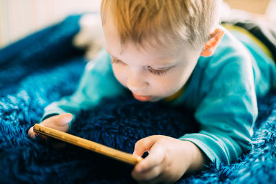 Boy playing with toy at home