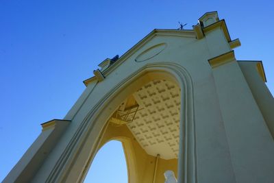 Low angle view of church against clear blue sky