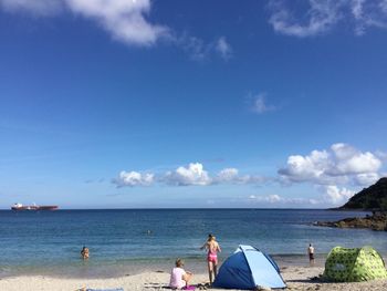 Rear view of people on beach