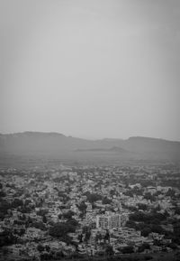 Aerial view of townscape against clear sky