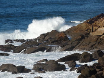 Waves splashing on rocks