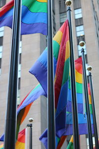 Low angle view of flags against building