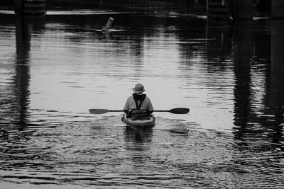 Man rowing boat on lake