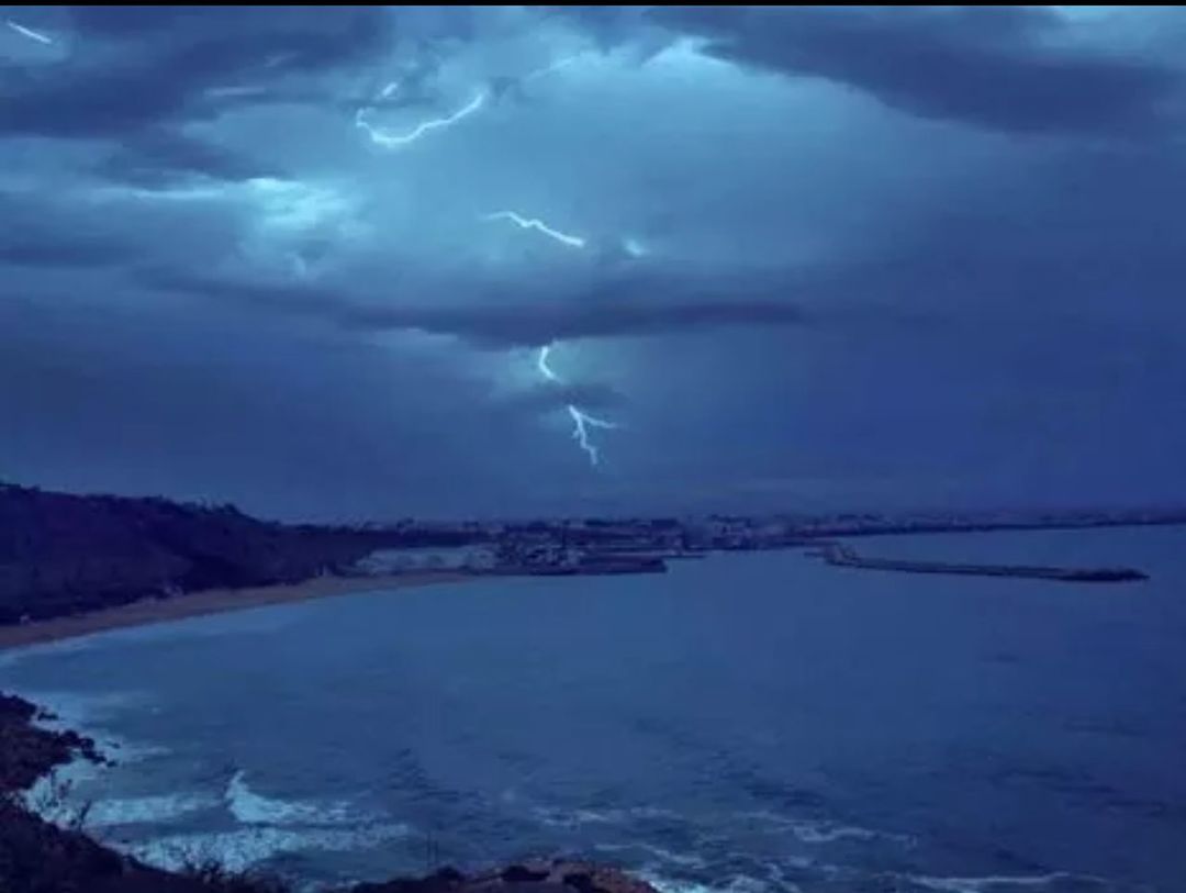 sky, scenics, cloud - sky, water, beauty in nature, tranquil scene, tranquility, sea, cloudy, nature, weather, power in nature, aerial view, dusk, cloud, idyllic, mountain, storm cloud, blue, dramatic sky