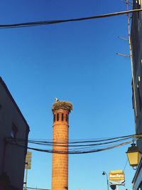 Low angle view of built structure against blue sky