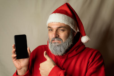 Portrait of mature man using mobile phone