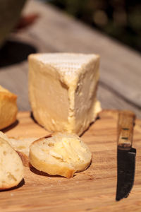 Close-up of bread with cheese on wooden table