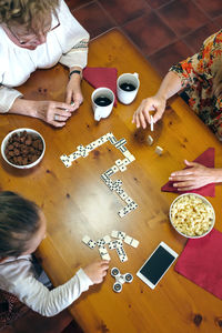 High angle view of woman sitting on table