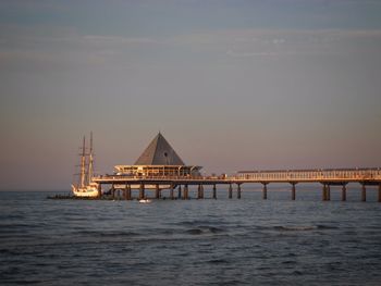 Pier on sea against sky