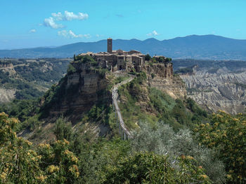View of castle on mountain against sky