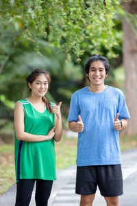 Portrait of a smiling girl standing outdoors