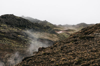 Scenic view of waterfall against clear sky