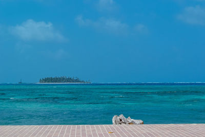 Scenic view of sea against blue sky