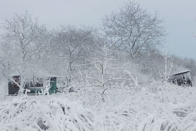 Snow on field against sky during winter