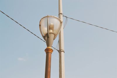 Low angle view of street light against sky