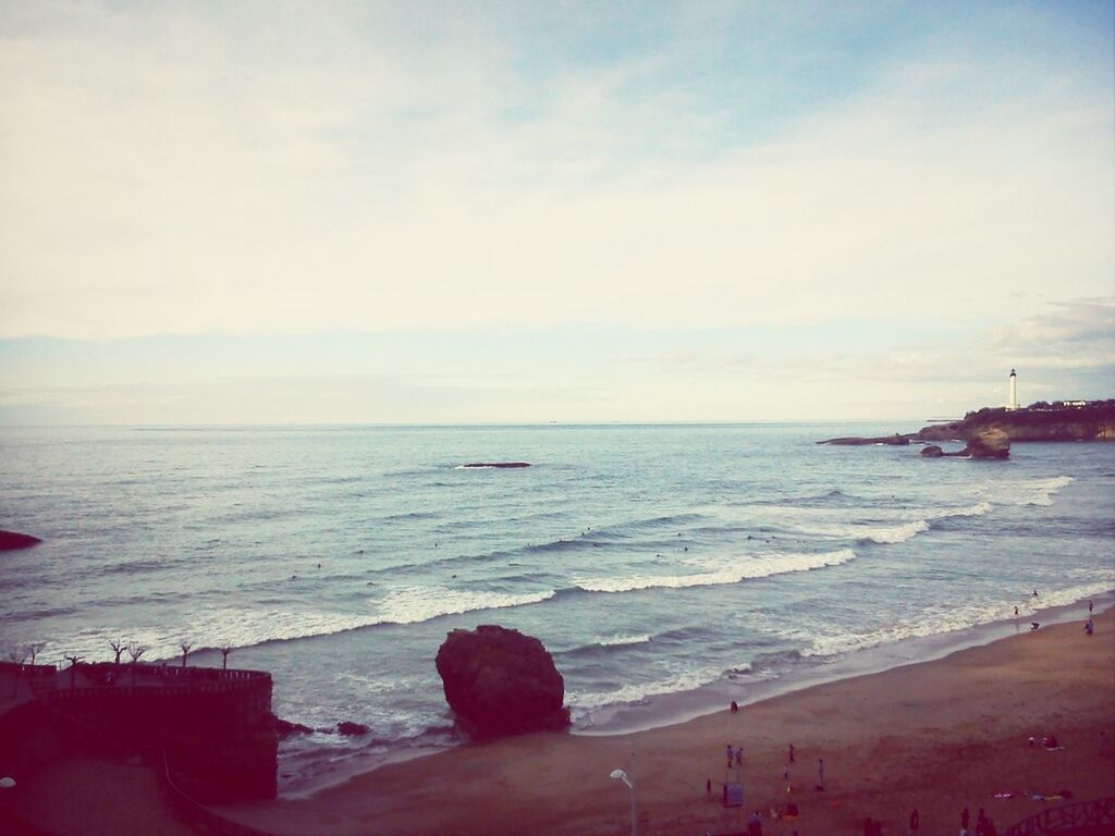 sea, horizon over water, beach, water, sky, shore, scenics, sand, tranquil scene, beauty in nature, tranquility, nature, cloud - sky, idyllic, coastline, vacations, wave, incidental people, outdoors