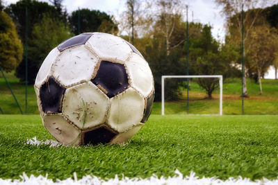 Close-up of soccer ball on field