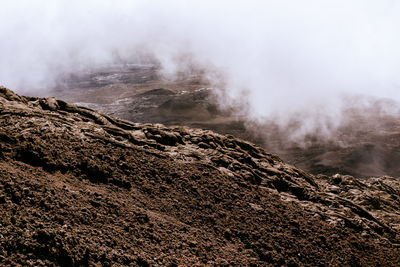 Smoke emitting from volcanic mountain