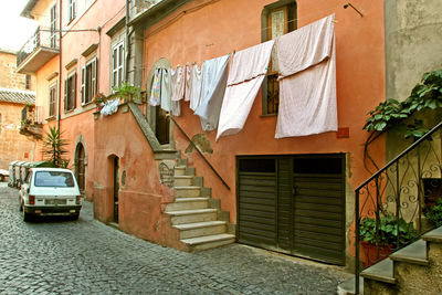 Clothes drying outside house