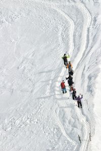 High angle view of people skiing in snow