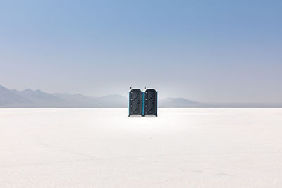 Doors on snow covered landscape during winter