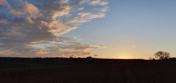 Scenic view of silhouette landscape against sky during sunset