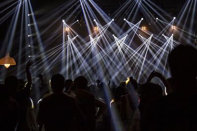 Large group of people enjoying music concert