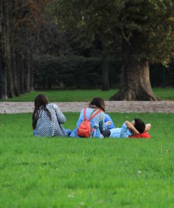 People sitting on grassland