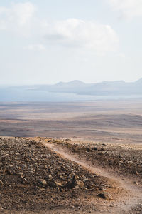 Scenic view of land against sky in lanzarote 