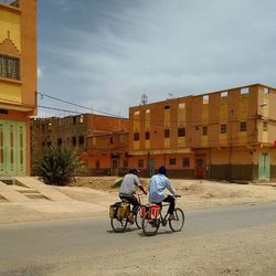 Woman riding bicycle on road