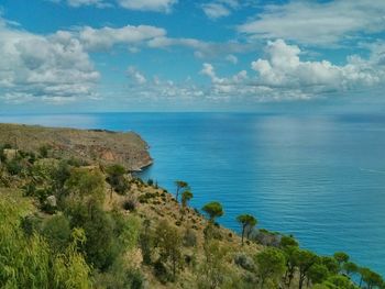 Scenic view of sea against cloudy sky