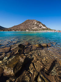 Scenic view of sea against clear blue sky