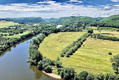 Scenic view of agricultural field against sky