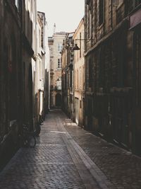 Alley amidst buildings in city