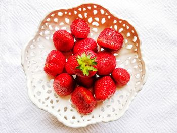 High angle view of strawberries in bowl on table