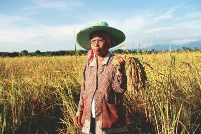 Portrait of man working in wheat field