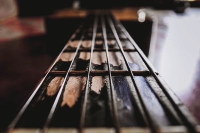 Close-up of guitar on table