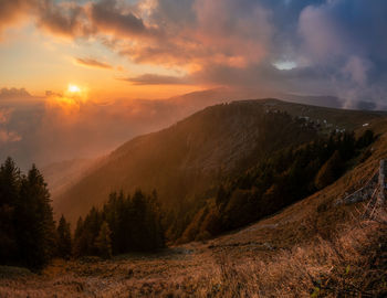 Scenic view of mountains against sky during sunset