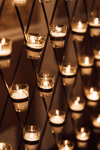 Close-up of lit tea light candles