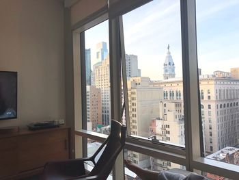 Buildings seen through glass window